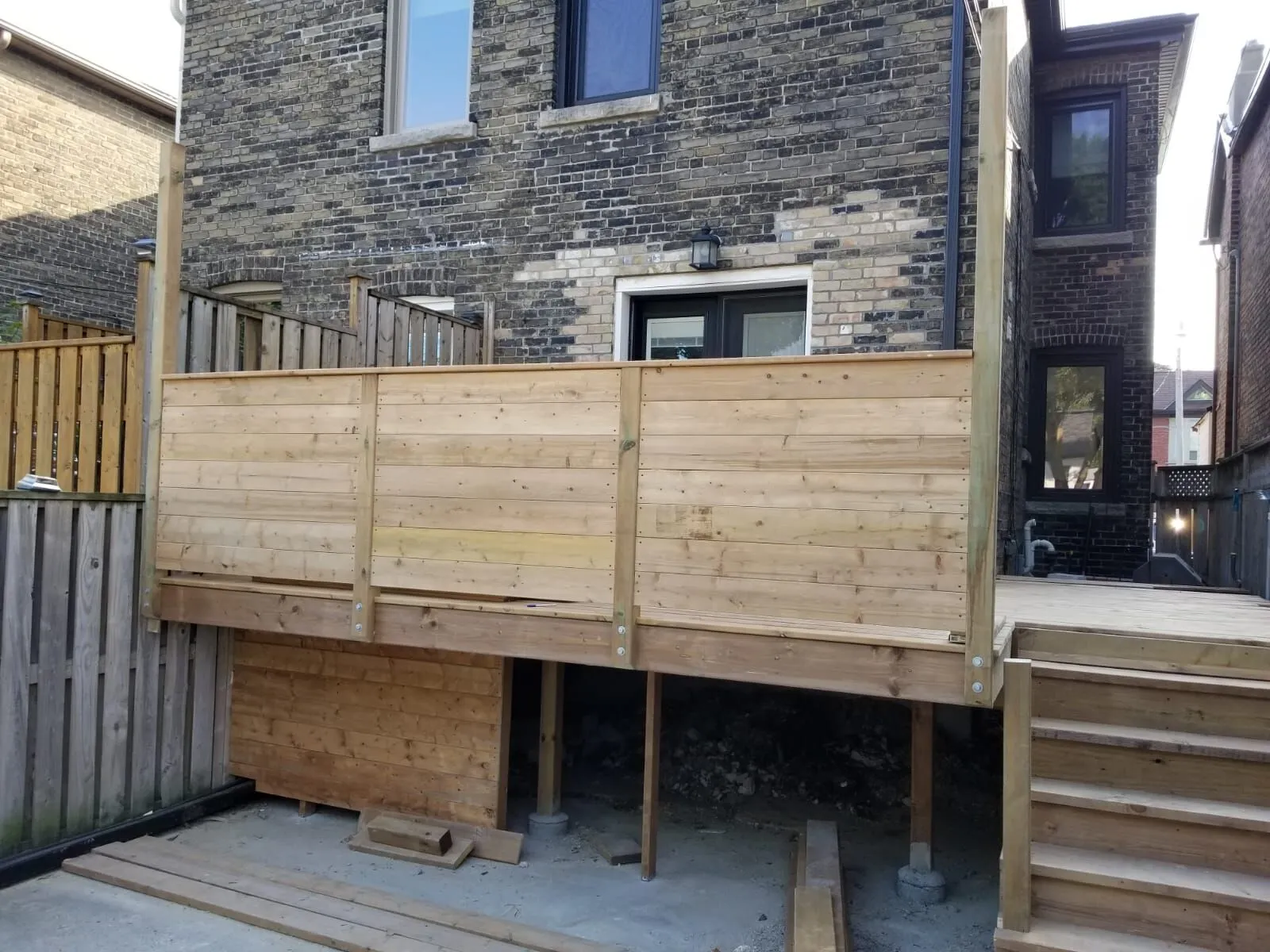Deck framing in progress on a Toronto backyard build