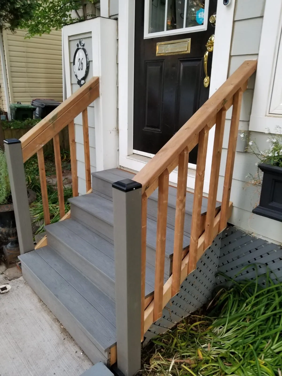 Rebuilt front porch steps with cedar railing