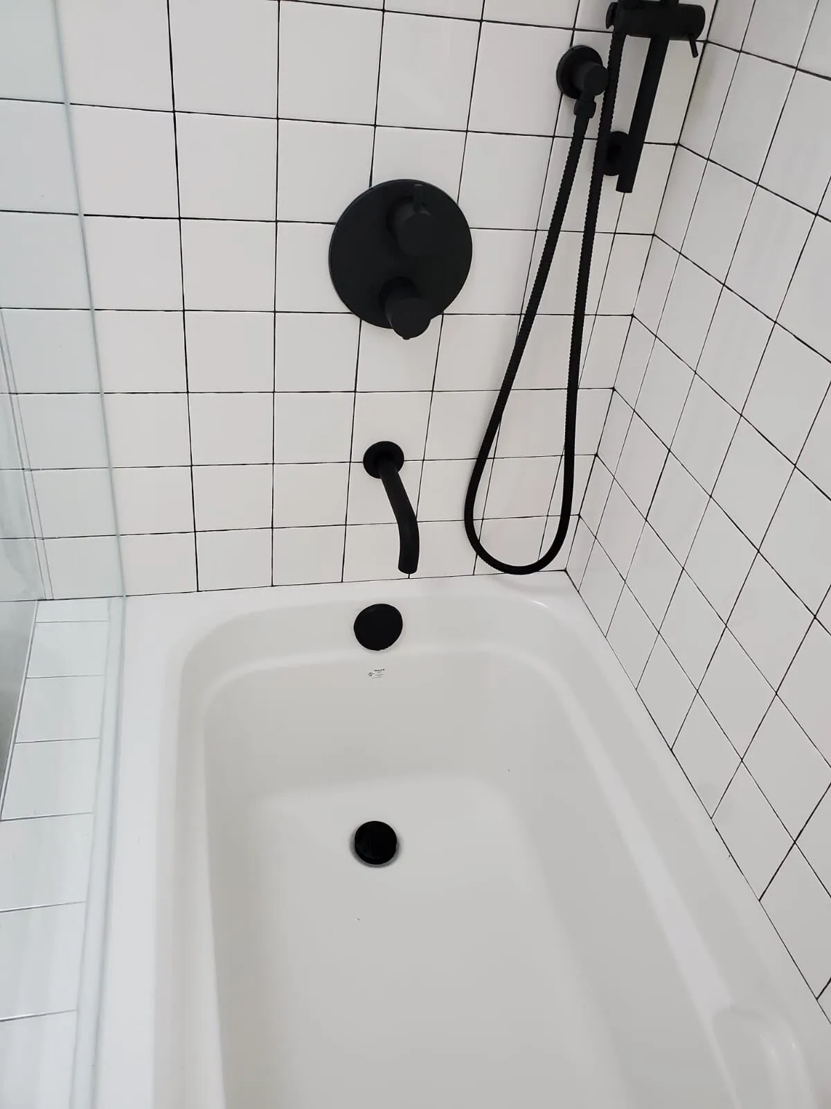 Matte black bathroom fixtures installed by EH Contracting